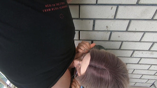 Cumshot in the mouth behind the garages